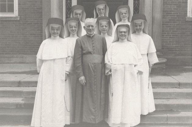 Monsignor William Barry and Mother Mary Gerald Barry, O.P., with a group of Adrian Dominican Sisters